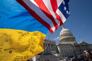 Flags flutter as pro-Ukrainian supporters demonstrate outside the U.S. Capitol after the U.S. House of Representatives voted on legislation providing $95 billion in security assistance to Ukraine, Israel and Taiwan, at Capitol Hill in Washington, U.S., April 20, 2024. REUTERS/Ken Cedeno